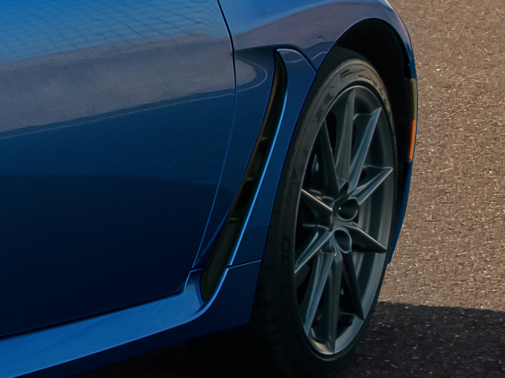 Close up of air outlet vents and side sill spoiler.