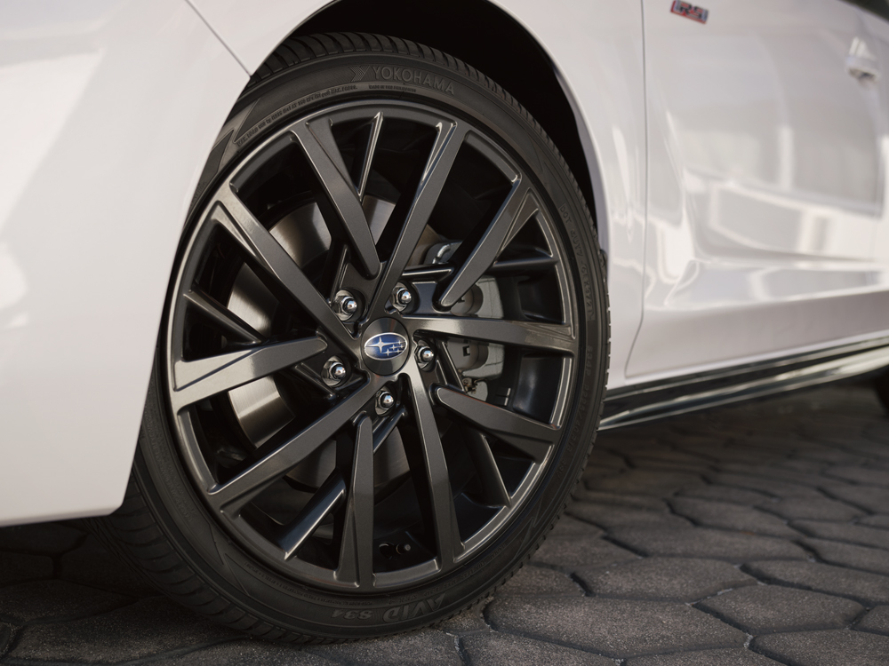 Close up of 17-inch aluminum alloy wheels with gloss black finish.