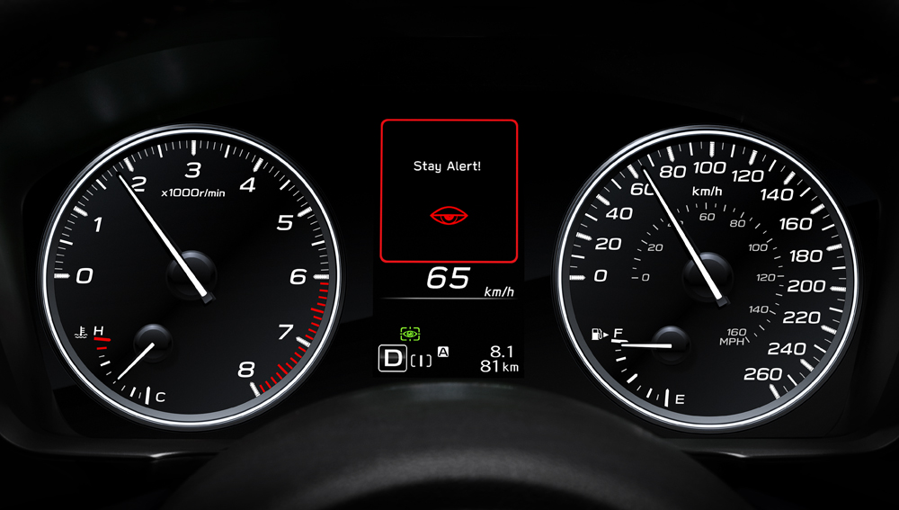 DriverFocus® Driver Monitoring System (DMS) warning on front dash gauges of 2026 Impreza Sport-tech.