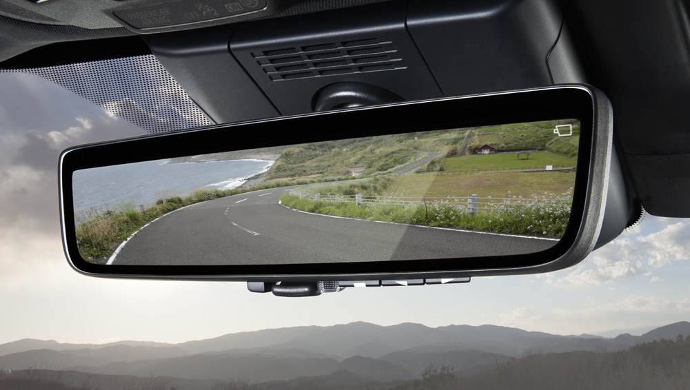 Close-up shot of auto-dimming smart rearview mirror with Homelink®.