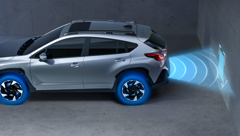 Rear parking sensors detecting an obstacle while reversing.