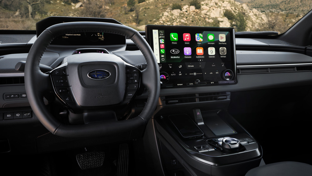 Wide shot of the front dash and seats.