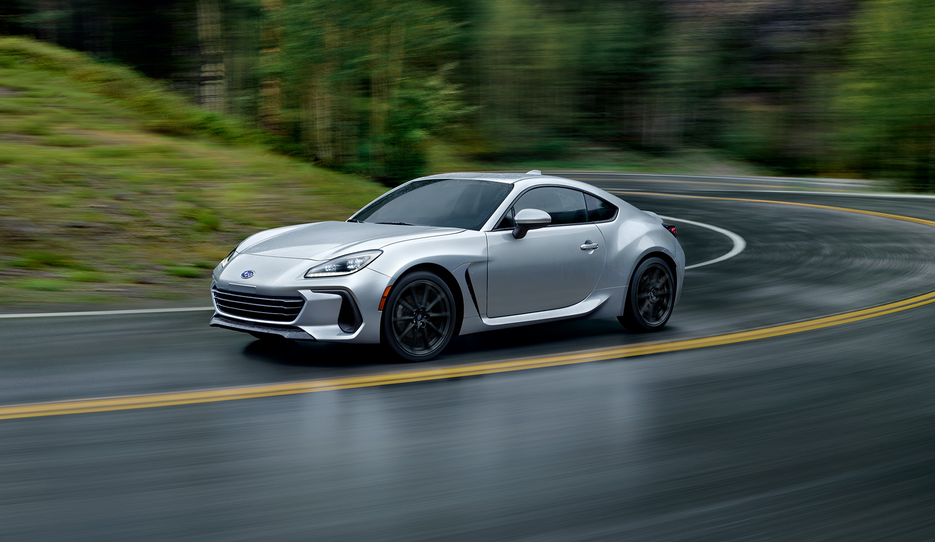 2024 BRZ rounding the curve on a mountain road.