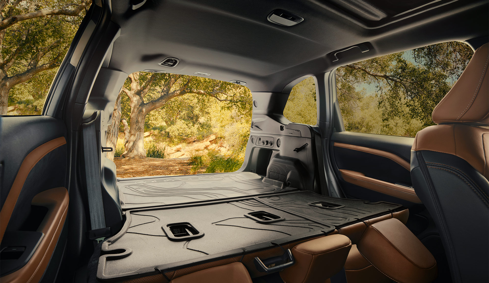 2025 Subaru Forester interior showing cargo space with rear seats folded down.