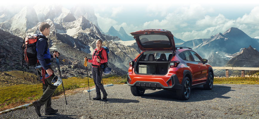 Parked Crosstrek outside in nature, couple going on a hike.