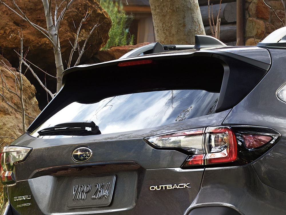 Closeup of 2025 Outback roofline rear spoiler and integrated brake light.