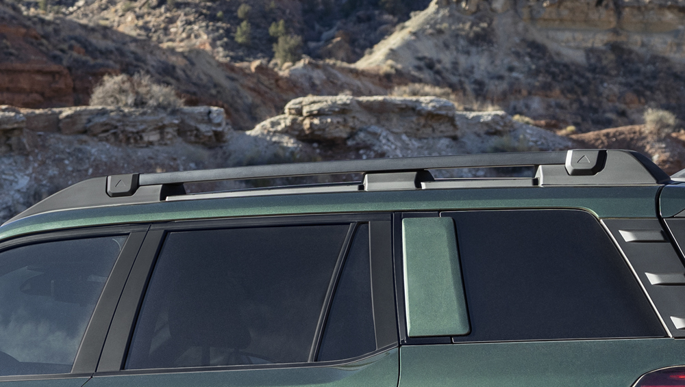 Closeup of 2026 Outback roof rails with swing-in-place crossbars.