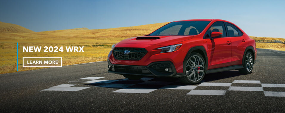 The red hot 2024 WRX RS strikes a pose at the finish line, showing off its new alloy wheels and Brembo® brakes.