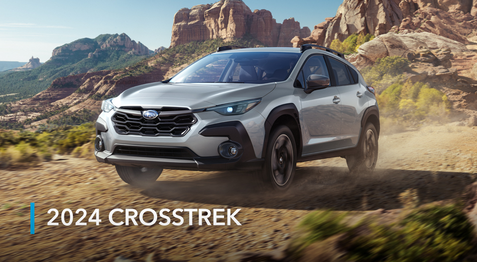 2024 Crosstrek driving on canyon road.