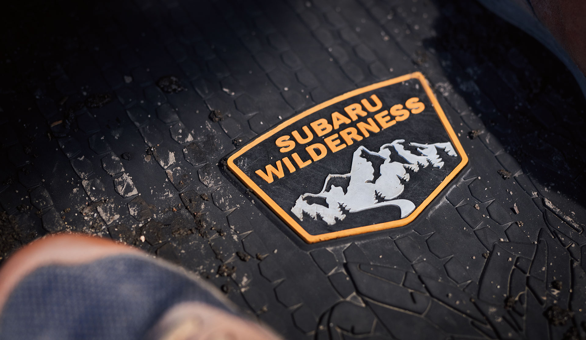 Shot of Wilderness logo on the all-weather floor mat.