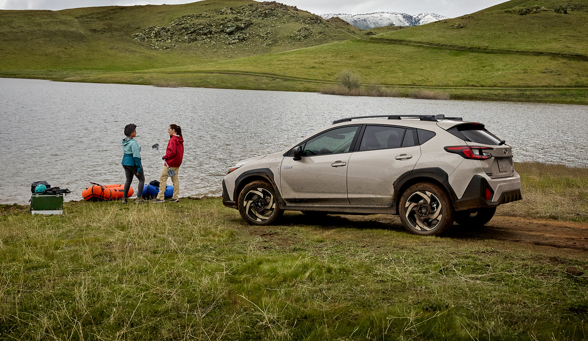 2026 Crosstrek Hybrid parked by a lake.