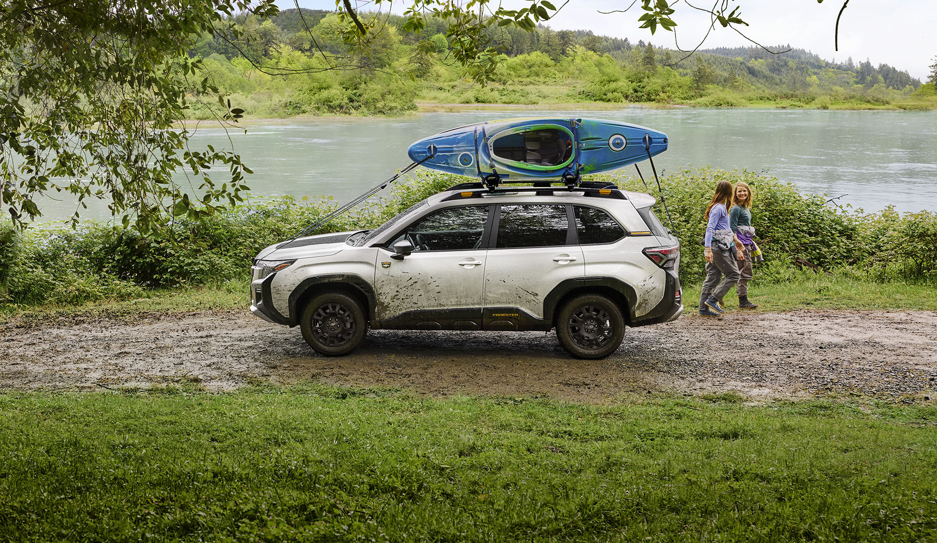 Parked 2026 Subaru Forester Wilderness with kayaks on roof racks. 