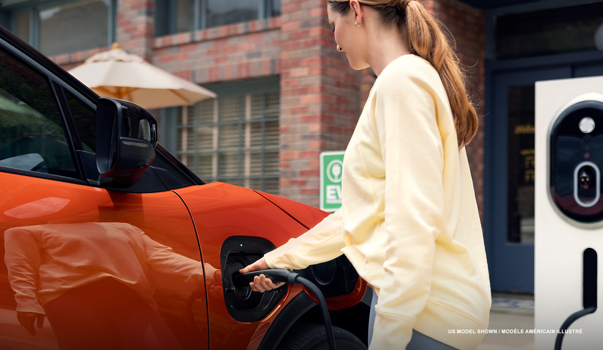 Closeup of a woman plugging in the Uncharted to the charging station.
