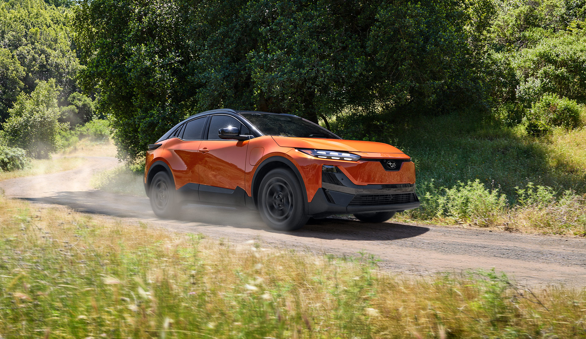 2026 2026 Subaru Uncharted  moving along a wooded trail.