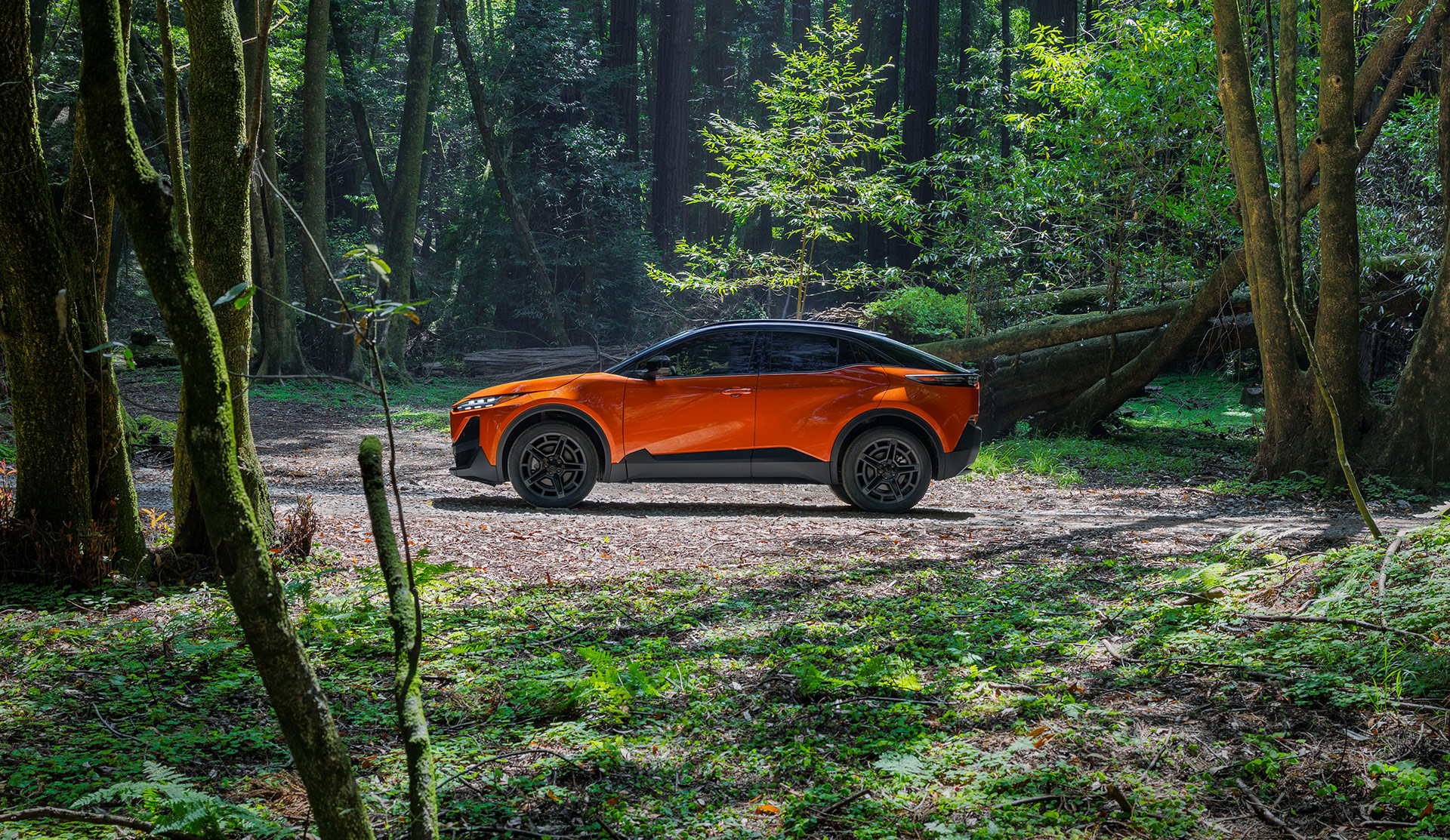 Side shot of 2026 Uncharted driving in a forested area.